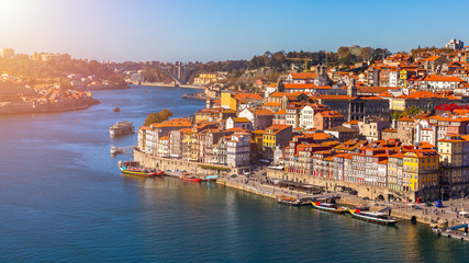 Colorful houses of Porto Ribeira, traditional facades, old multi-colored houses with red roof tiles...