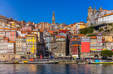Fototapeta na wymiar Ancient city of Porto with old multi-colored houses with red roof tiles. Portugal, Porto