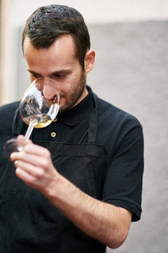 A sommelier is enjoying wine testing