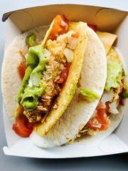 beef tacos served with lettuce and fresh tomatoes