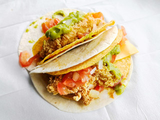 beef tacos served with lettuce and fresh tomatoes