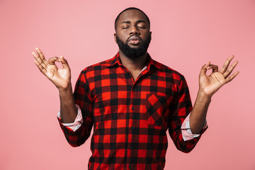 Portrait of a calm african man wearing plaid shirt