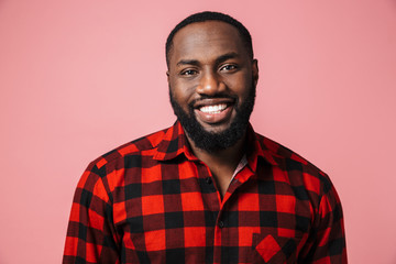 Portrait of a happy african man wearing plaid shirt