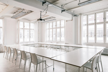 Empty Bright White Conference Room in Industrial Coworking Space