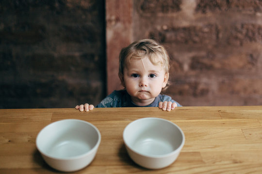 Toddler with bowls