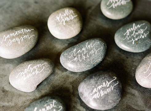 River rocks with fake names in beautiful calligraphy