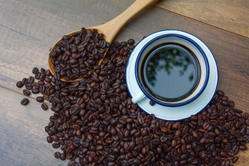 Coffee bean in a wooden spoon