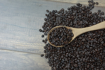 Coffee bean in a wooden spoon