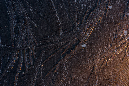 Frozen ice on stone background