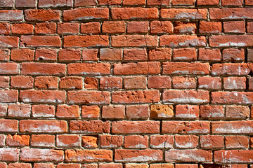 The texture of the old red brick wall