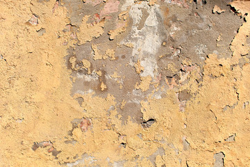Texture of old peeling beige wall surface