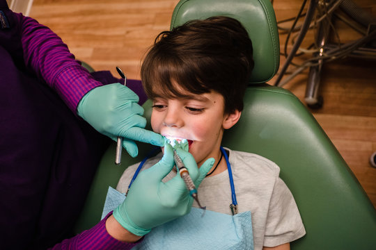 child gets teeth cleaned at the dentist