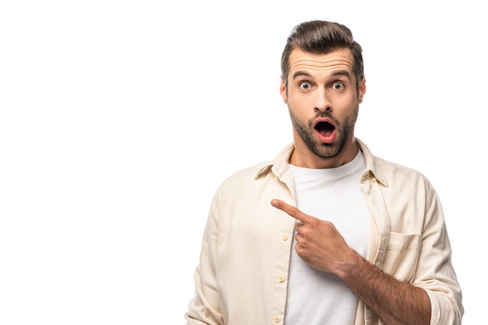 surprised man looking at camera and pointing with finger Isolated On White with copy space