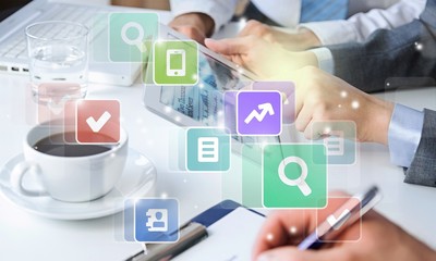 Business people making report using tablet, coffee