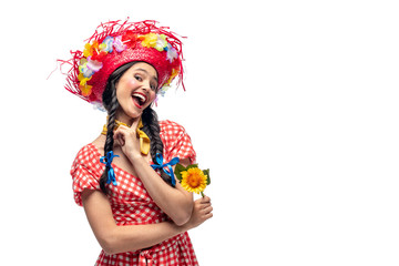 Fototapeta na wymiar excited girl in festive clothes and Straw Hat touching chin Isolated On White