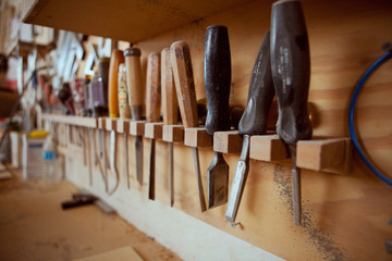 Woodworking: Row Of Chisels Above Workbench