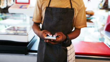 Anonymous man using phone at work.