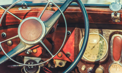 steering wheel and dashboard of an old retro car close up