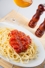 Macaroni with tomato sauce on white background