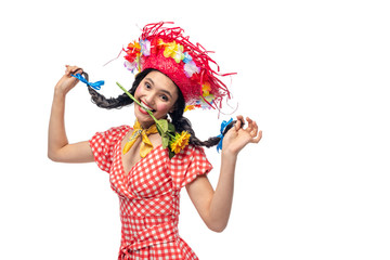 happy girl in festive clothes and Straw Hat biting sunflower Isolated On White