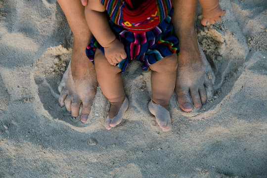Father and Baby feet in the Sand