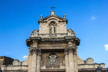 Catania baroque architecture detail of roof of a basilica with statues and columns