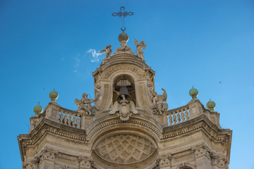Fototapeta na wymiar Catania detail of baroque architecture in basilica Collegiata, top of facade decorations