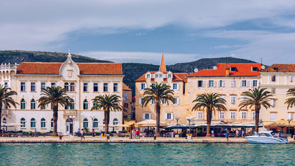 Fototapeta na wymiar View at town Trogir, old touristic place in Croatia Europe. Trogir town coastal view. Magnificent Trogir, Croatia. Sunny old Venetian town, Dalmatian Coast in Croatia.