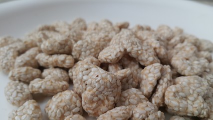 Closeup view of home made Asian sweet feed rewri or rewdi