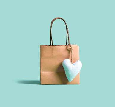 A shopping bag with small heart cushion
