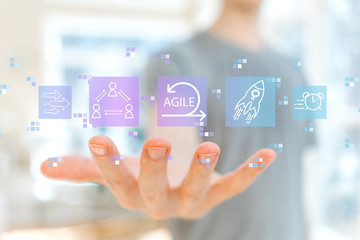 Agile concept with young man holding his hand