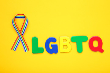 Abbreviation LGBT on yellow background