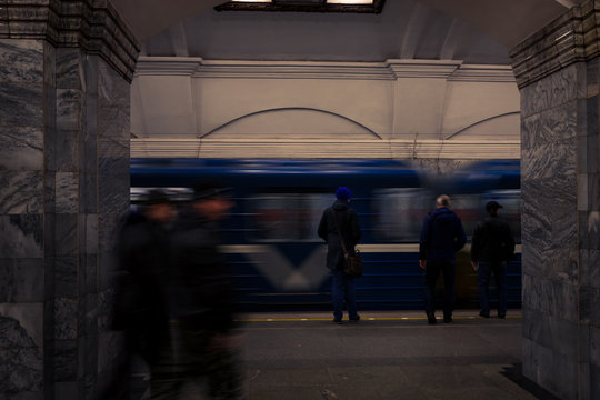 Passenger waiting for the subway at Kirovsky Zavod metro station (Kirovsko-Vyborgskaya Line) (Saint Petersburg, Russia, Europe)