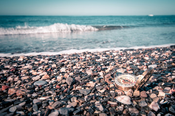 compass next to the mediterranean sea