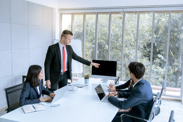 Young business people are presented marketing work project to the customer in meeting room office