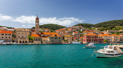 Obraz premium Pucisca is small town on Island of Brac, popular touristic destination on Adriatic sea, Croatia. Pucisca town Island of Brac. Adriatic coast town Pucisca.