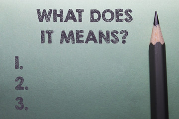 Writing note showing What Does It Means question. Business concept for asking meaning something...