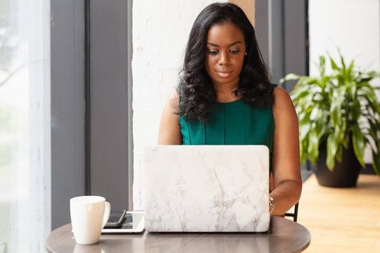 Portrait of businesswoman working on laptop