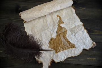 map of cameroon on vintage paper with old pen on the wooden texture desk