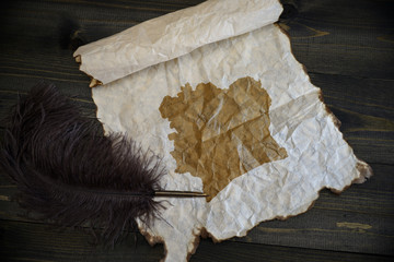 map of cote divoire on vintage paper with old pen on the wooden texture desk