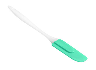 Green silicone spatula with handle on an isolated white background