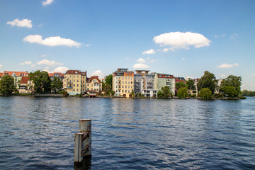 Romantic views of the river Dahme and Spree in Berlin Koepenick with houses on the shore, bridges, ships and boats
