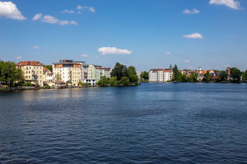 Romantic views of the river Dahme and Spree in Berlin Koepenick with houses on the shore, bridges, ships and boats