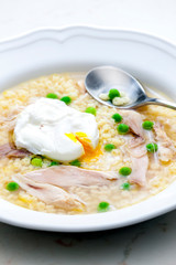 still life of poultry soup with egg