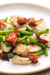 still life of chicken meat with green beans and bacon