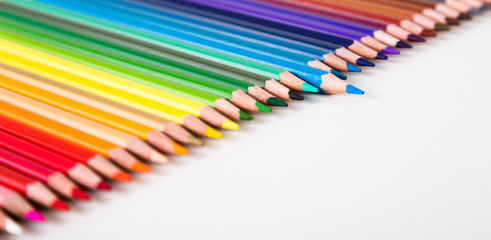 colored pencils lying in row