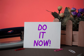 Conceptual hand writing showing Do It Now. Concept meaning not hesitate and start working or doing...