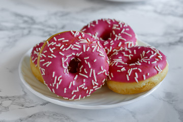 Donaltsa donuts with pink icing