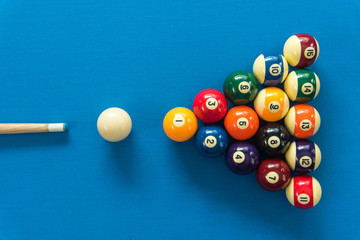 pool or billiards balls on light blue table - Powered by Adobe