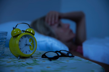 Woman struggling to wake up in the morning